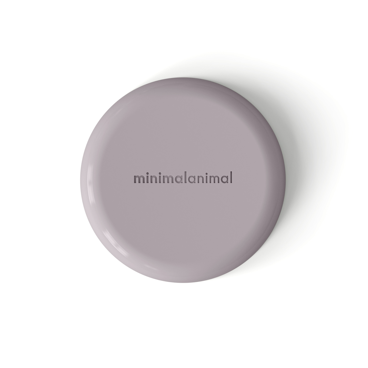 Circular modern lavender silicone lick mat designed for use with ceramic bowl for dogs and cats