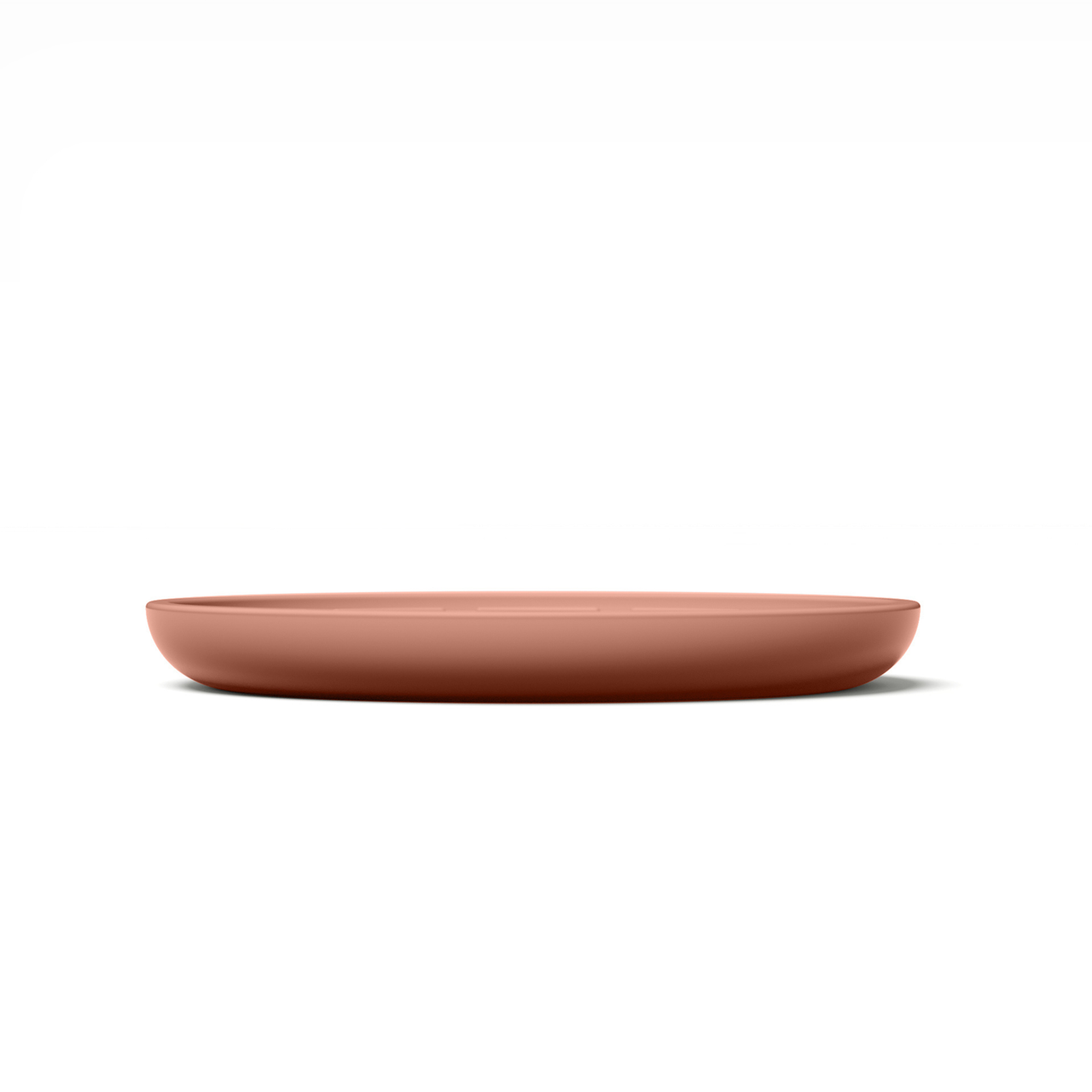 Circular modern coral pink silicone lick mat designed for use with ceramic bowl for dogs and cats