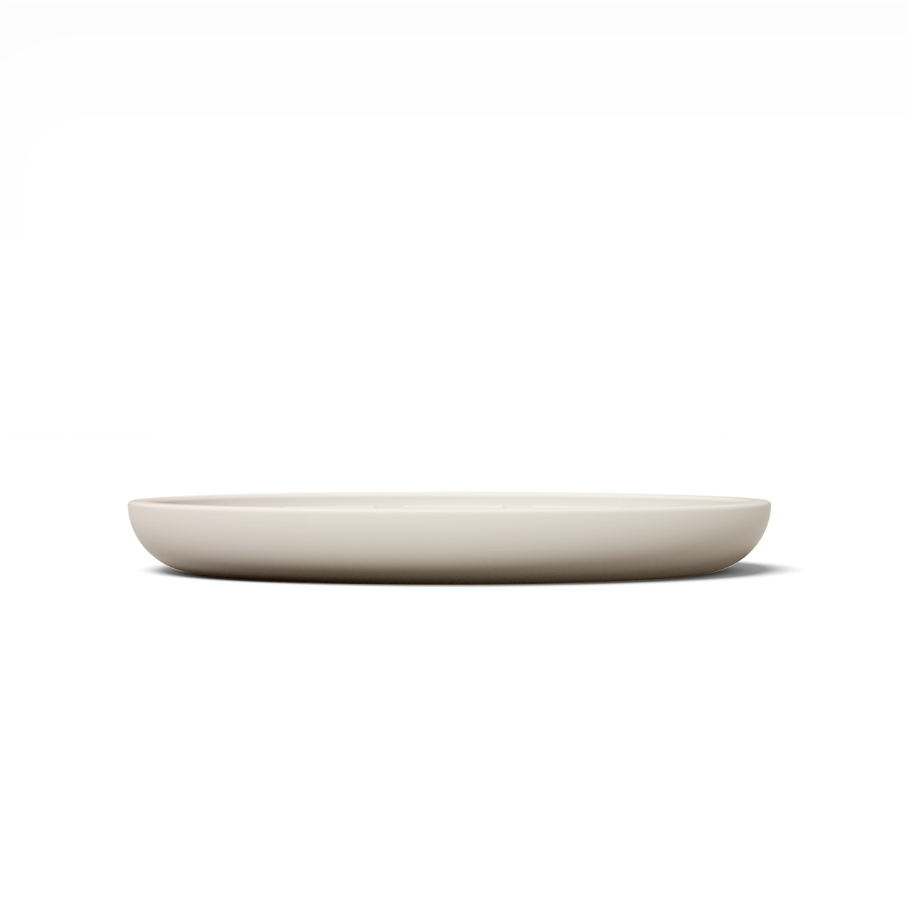Circular modern tan silicone lick mat designed for use with ceramic bowl for dogs and cats