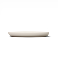 Thumbnail for Circular modern tan silicone lick mat designed for use with ceramic bowl for dogs and cats