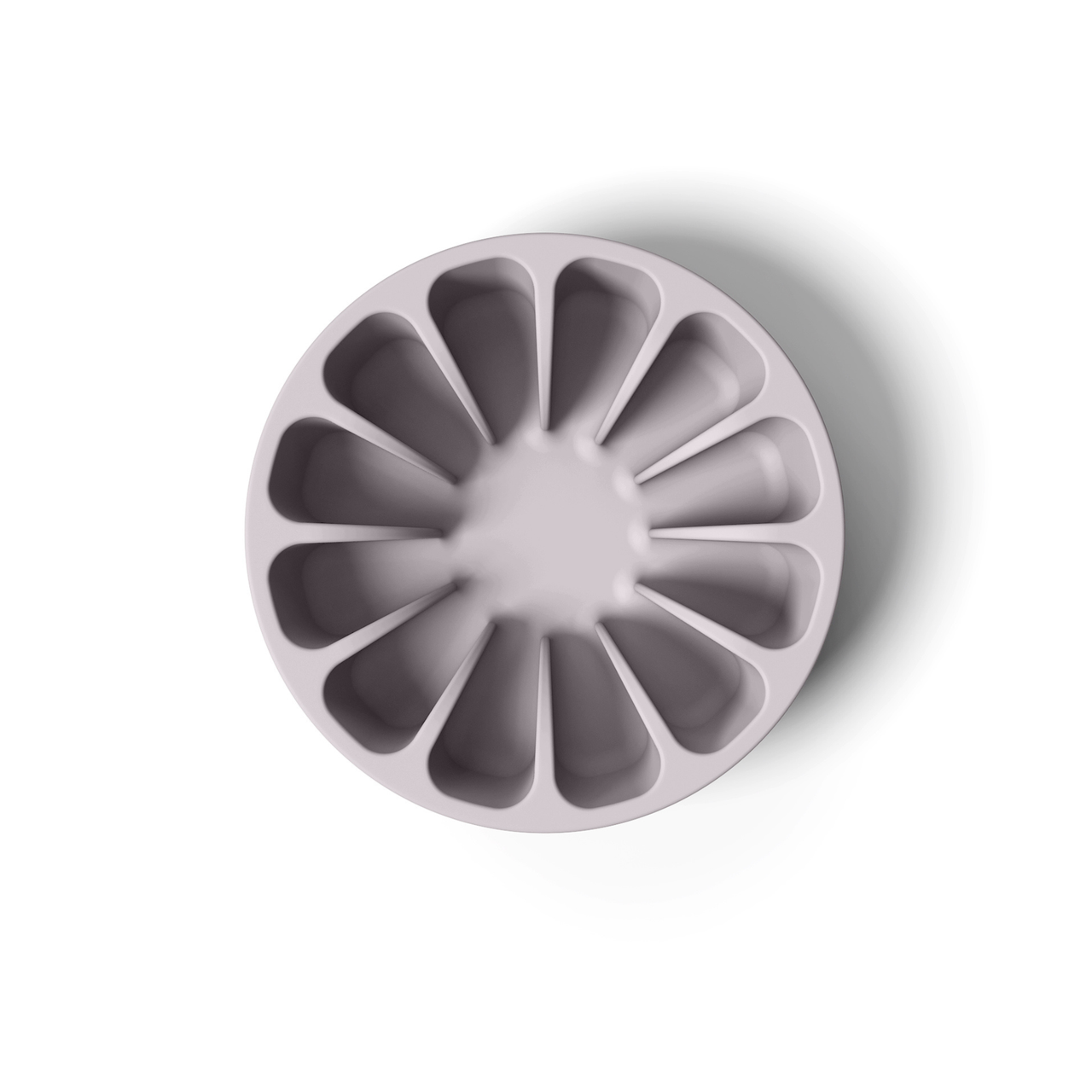 Dusty lavender minimalist circular silicone slow feeder designed to resemble grapefruit for dog use