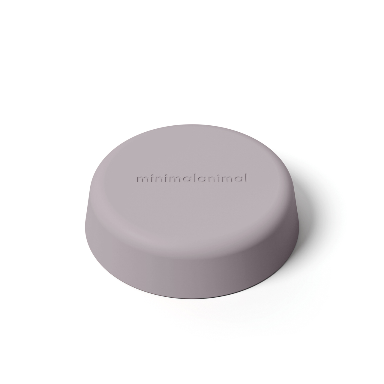 Dusty lavender minimalist circular silicone slow feeder designed to resemble grapefruit for dog use