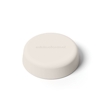 Thumbnail for Light tan minimalist circular silicone slow feeder designed to resemble grapefruit for dog use