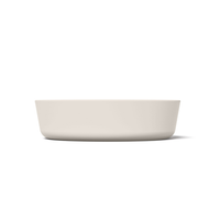 Thumbnail for Light tan minimalist circular silicone slow feeder designed to resemble grapefruit for dog use
